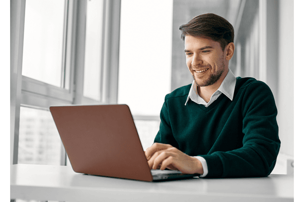 A GPHR exam candidate preparing for the certification exam on a laptop