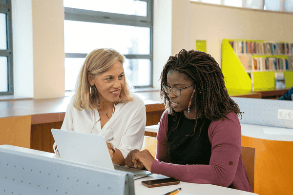 Two Praxis exam candidates studying together 