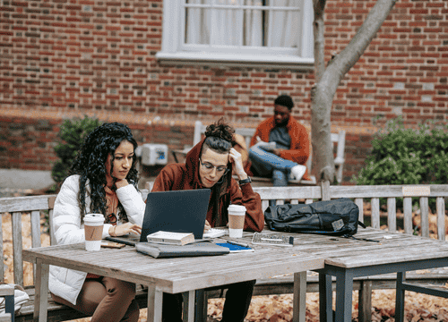 Aspiring Physical Education teachers prepare for the Praxis II exam using free practice tests, working together to review key topics and sharpen their test-taking skills.