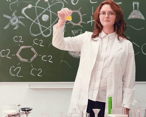 A chemistry teacher conducting an experiment 