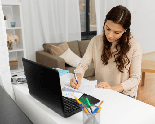 A person studying for the CLEP Composition Modular exam on a laptop