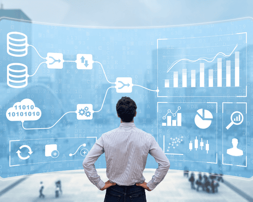 An Infromation sysytems expert infront of a huge display