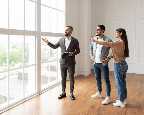 A real estate salesperson speaking to clients