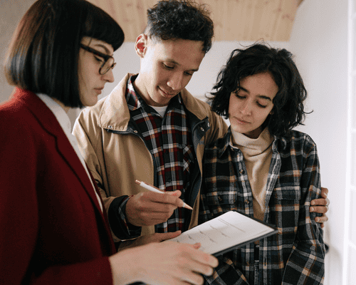 A Real Estate salesperosn speaking to clients